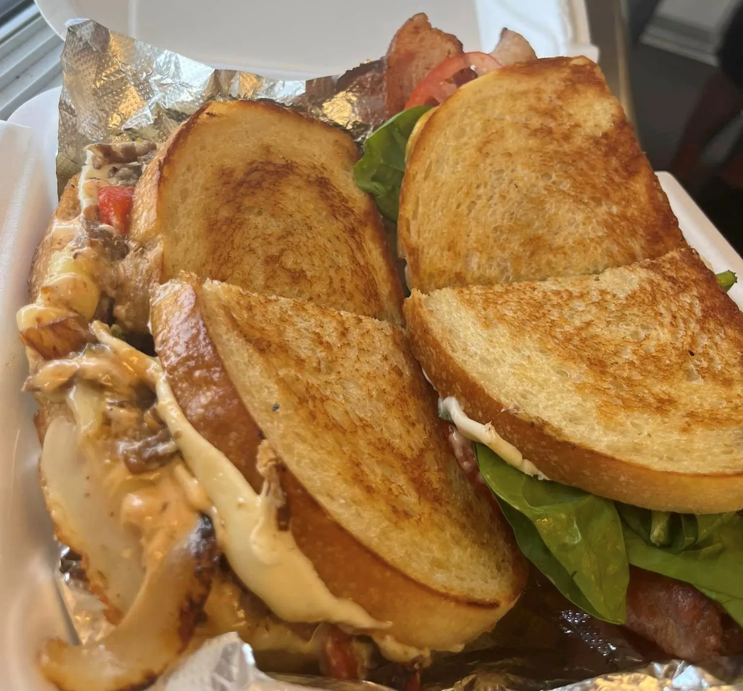 Octane InterLounge signature dishes Gourmet Grilled Cheese, Black Bean Burger, Thai Peanut Wrap, Martinis